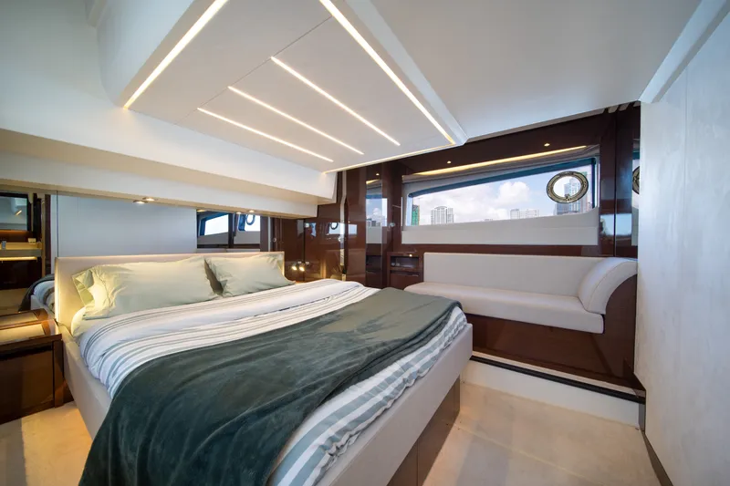 Slide: The Image of Luxurious bedroom interior of 2020 Prestige 520 yacht with modern design and large windows. - 2