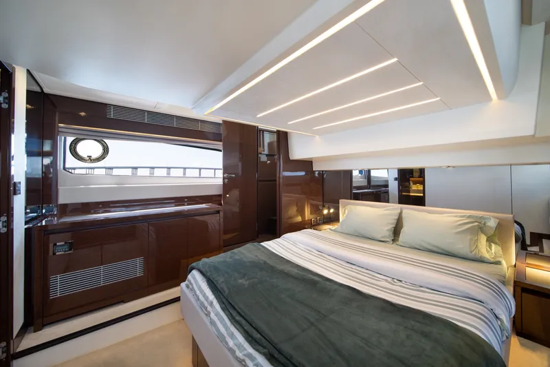 Slide: The Image of Luxurious interior of a 2020 Prestige 520 yacht bedroom with modern design and elegant lighting. - 20