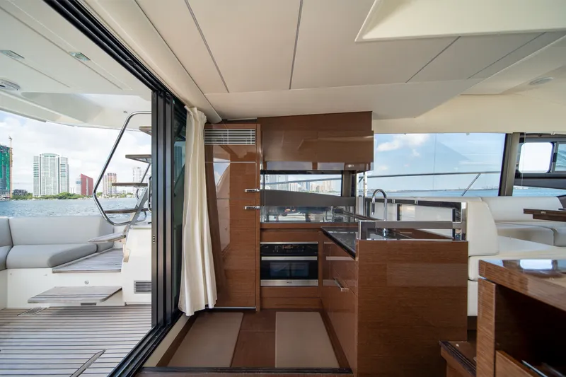 Slide: The Image of Luxurious interior of 2020 Prestige 520 yacht with modern kitchen and scenic water views. - 14