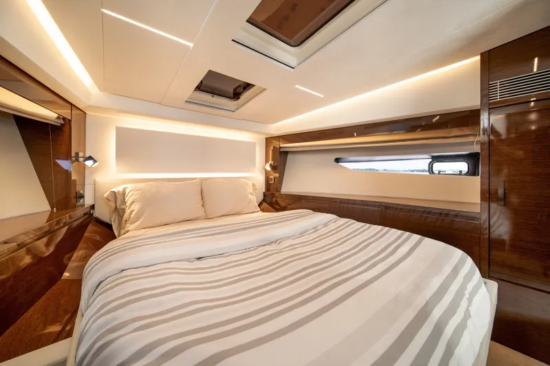 Slide: The Image of Luxurious bedroom interior of 2020 Prestige 520 yacht with modern design and elegant lighting. - 24
