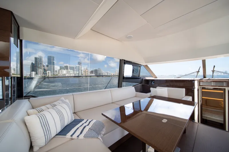Slide: The Image of Luxurious interior of 2020 Prestige 520 yacht with city skyline view. - 19