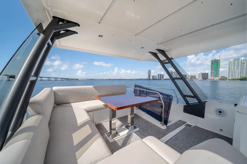 Slide: The Image of Luxurious 2020 Prestige 520 yacht interior with waterfront cityscape view. - 4