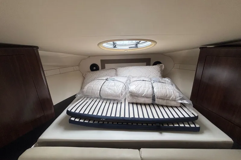 Slide: The Image of Interior cabin of 2018 Regal 33 XO yacht with bed and cushions. - 25