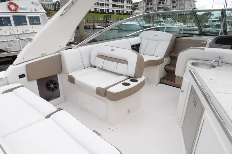 Slide: The Image of Luxurious interior of a 2018 Regal 33 XO boat with plush seating and modern amenities. - 9