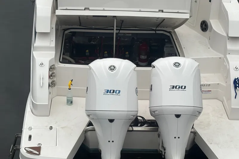Slide: The Image of 2018 Regal 33 XO boat with twin Yamaha 300 outboard engines. - 36