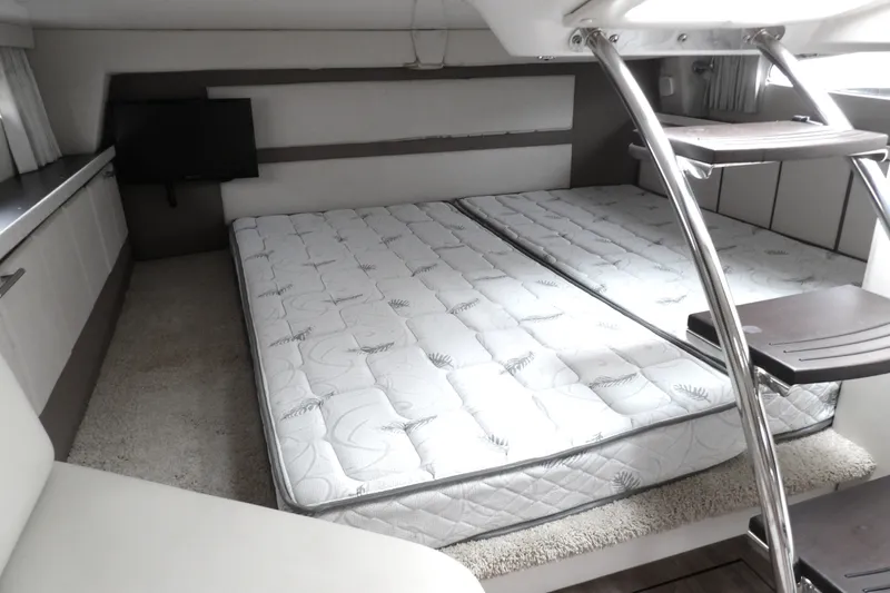 Slide: The Image of Interior cabin of 2018 Regal 33 XO yacht with twin mattresses and modern design. - 30