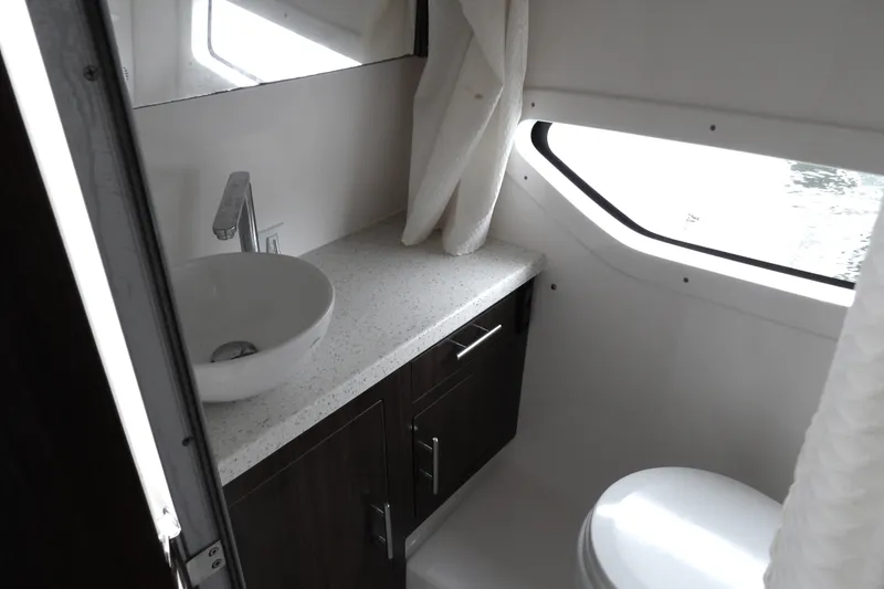 Slide: The Image of Luxurious bathroom interior of 2018 Regal 33 XO yacht with modern fixtures. - 33