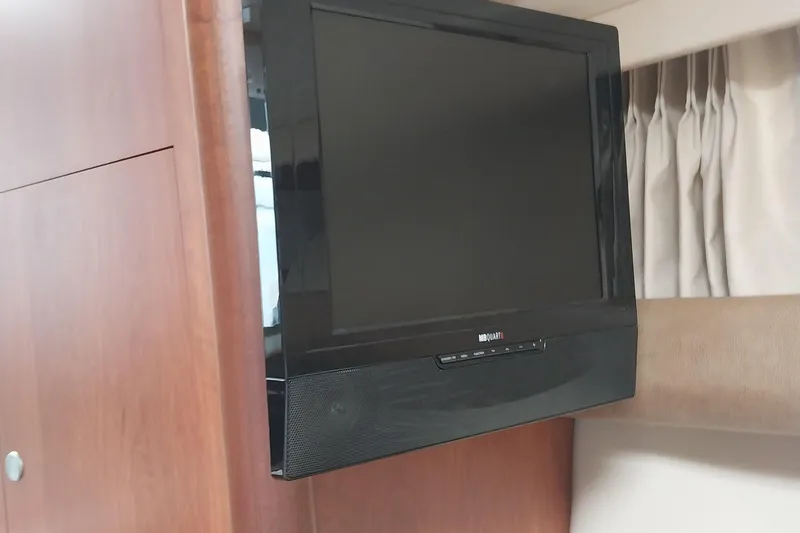 Slide: The Image of Flat-screen TV in 2011 Monterey 340 Sport Yacht interior. - 25