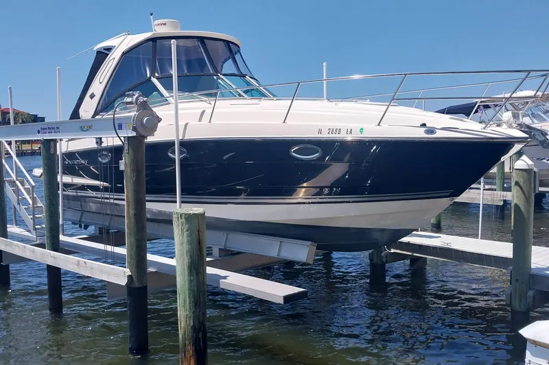 Slide: The Image of 2011 Monterey 340 Sport Yacht on lift at marina dock. - 4