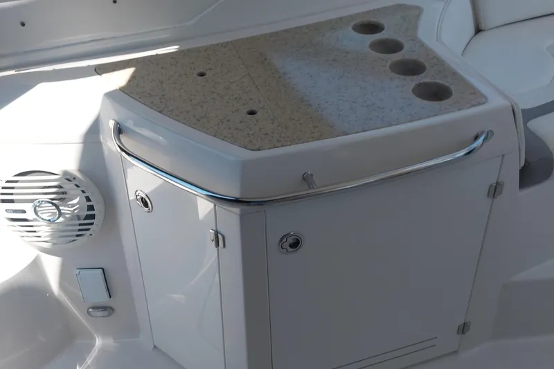 Slide: The Image of 2011 Monterey 340 Sport Yacht interior with countertop and cup holders. - 10