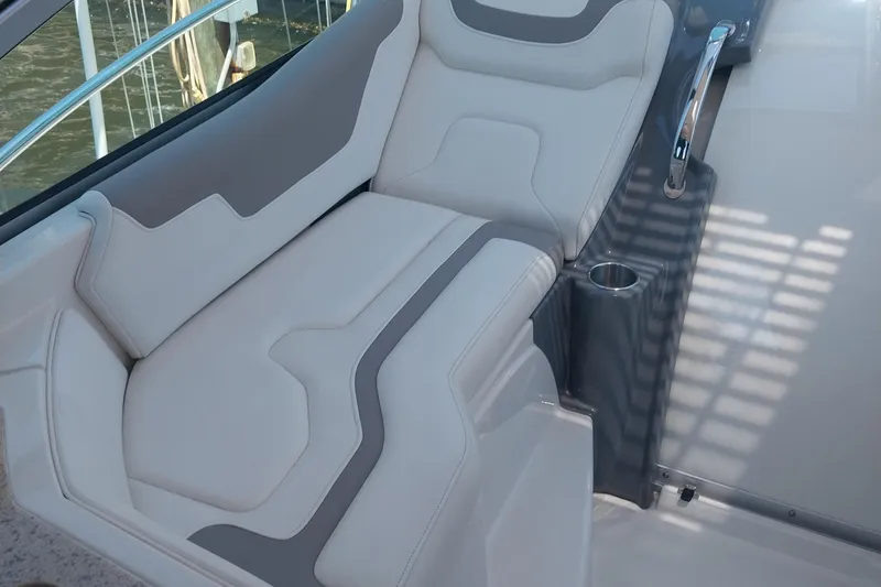 Slide: The Image of Luxurious seating on a 2011 Monterey 340 Sport Yacht with sleek design and cup holder. - 6