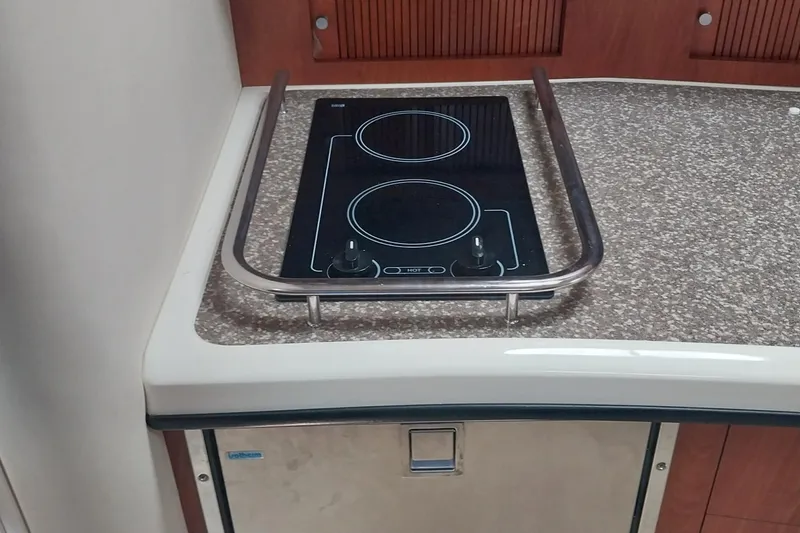 Slide: The Image of Stovetop in 2011 Monterey 340 Sport Yacht kitchen area with granite countertop. - 20
