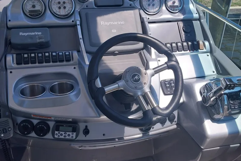 Slide: The Image of Steering console of a 2011 Monterey 340 Sport Yacht with Raymarine electronics. - 5