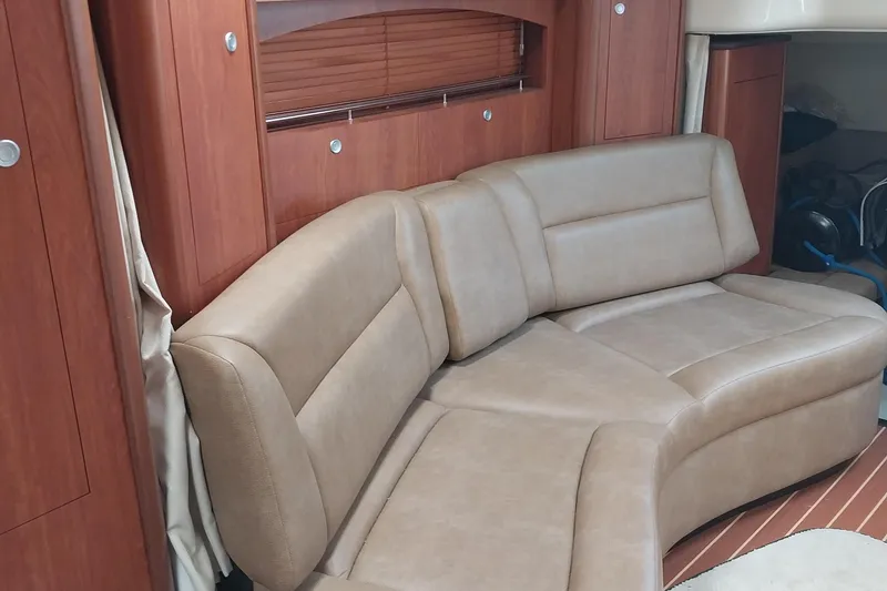 Slide: The Image of Luxurious interior of 2011 Monterey 340 Sport Yacht with beige leather seating. - 13