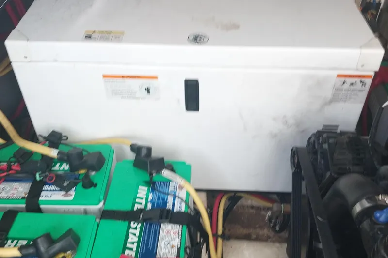Slide: The Image of Engine compartment of 2011 Monterey 340 Sport Yacht with batteries and equipment. - 28