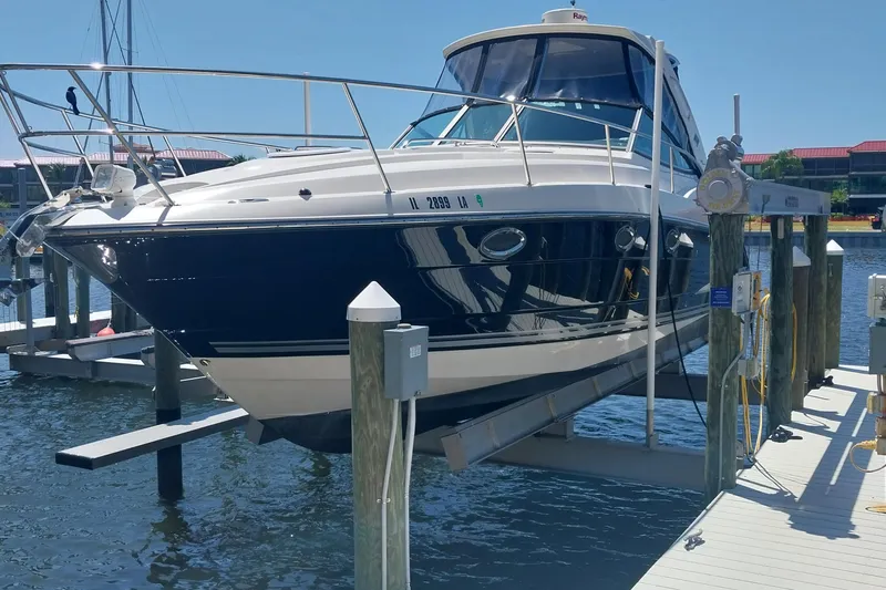 The Image of 2011 Monterey 340 Sport Yacht docked at marina, sunny day, blue water. - 1