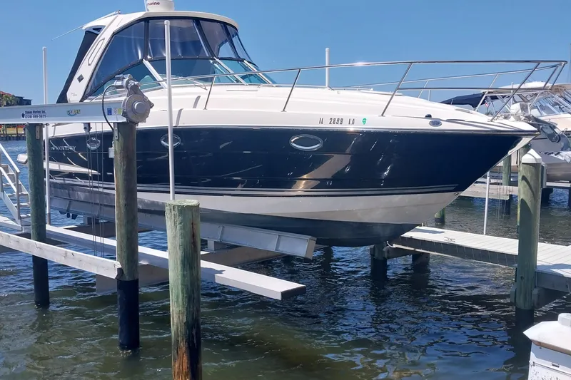 Slide: The Image of 2011 Monterey 340 Sport Yacht docked on a lift in a marina. - 3