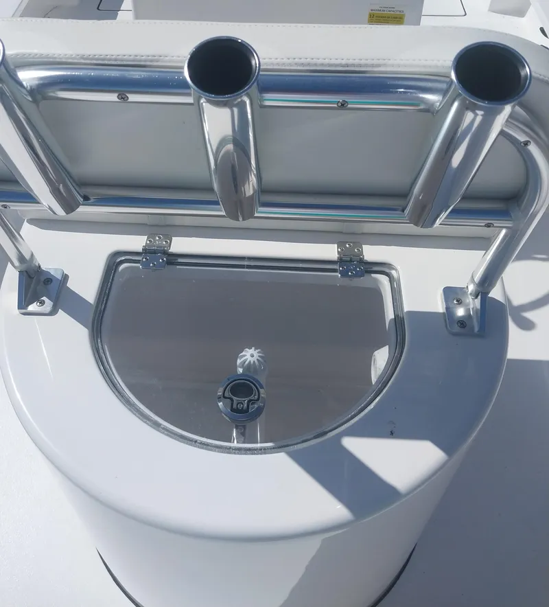 Slide: The Image of 2024 Savage Seas Shallow Bay SS22 boat with rod holders and storage compartment. - 14