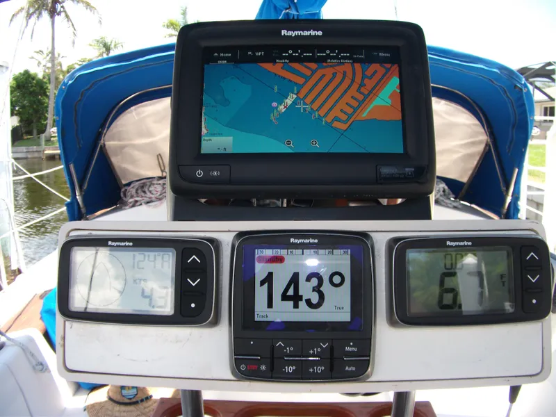 Slide: The Image of Navigation instruments on a 1992 Catalina 30 MkII sailboat, featuring Raymarine displays. - 32