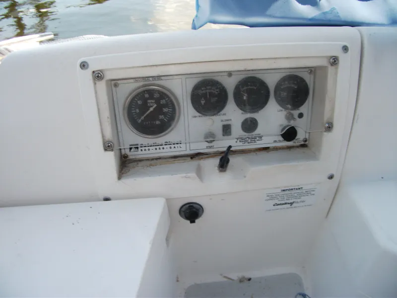Slide: The Image of Control panel of a 1992 Catalina 30 MkII sailboat with gauges and switches. - 26