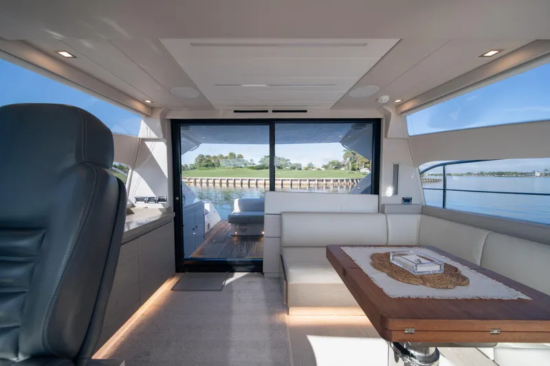 Slide: The Image of Luxurious interior of 2019 Filippetti S55 yacht with elegant seating and scenic water view. - 15