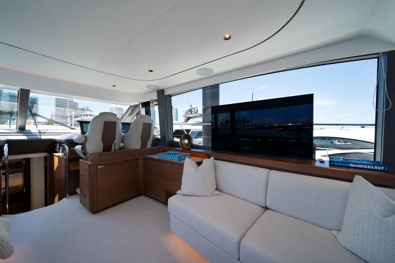 Slide: The Image of Luxurious interior of 2025 Princess F65 yacht with modern seating and panoramic windows. - 16