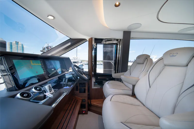 Slide: The Image of Luxurious interior of 2025 Princess F65 yacht with modern dashboard and plush seating. - 20