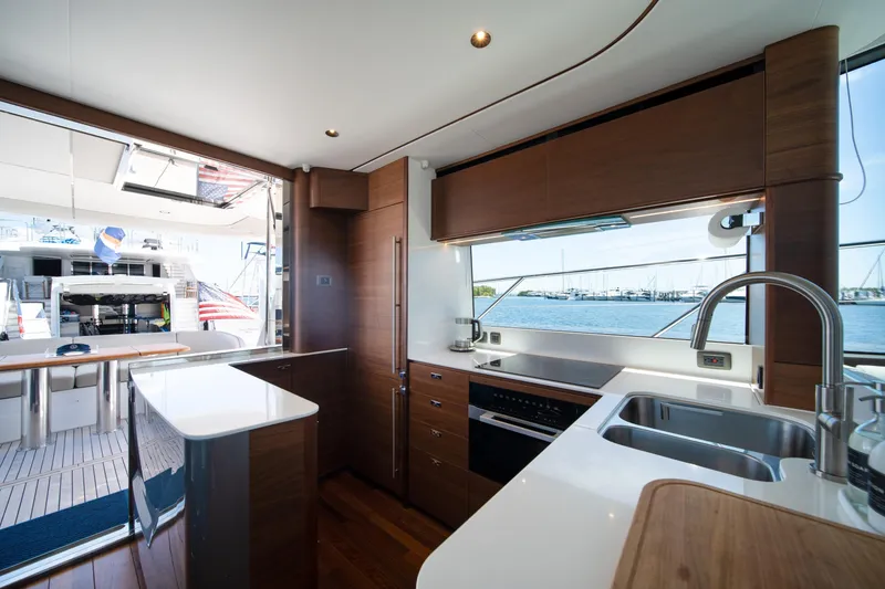Slide: The Image of Luxurious 2025 Princess F65 yacht kitchen with modern amenities and ocean view. - 12