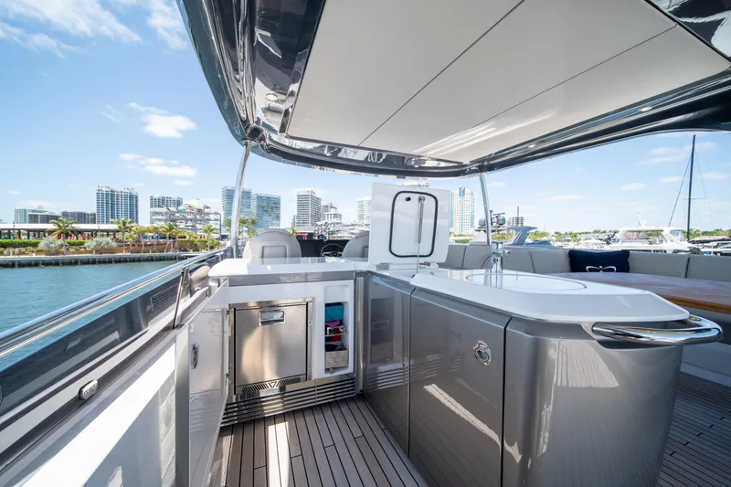 Slide: The Image of Luxurious 2025 Princess F65 yacht deck with modern amenities and city skyline view. - 43
