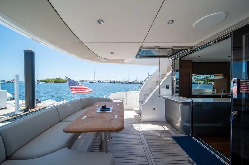 Slide: The Image of Luxurious 2025 Princess F65 yacht deck with seating, table, and ocean view. - 9