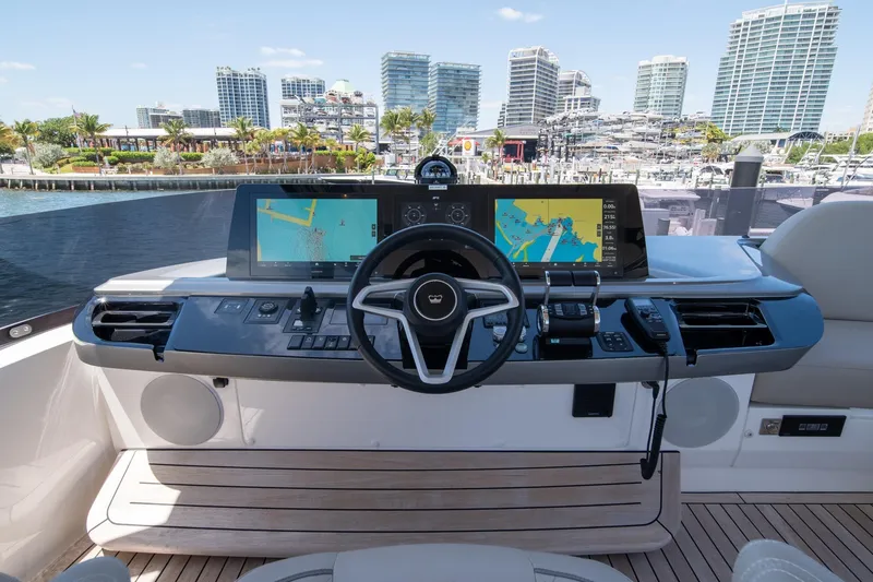 Slide: The Image of Helm of 2025 Princess F65 yacht with navigation screens and cityscape view. - 41