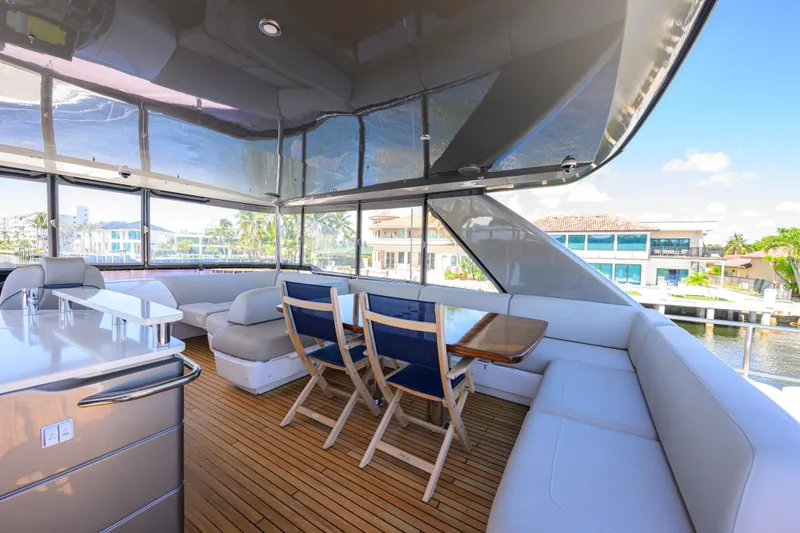 Slide: The Image of Luxurious 2020 Princess F70 yacht interior with elegant seating and dining area. - 51