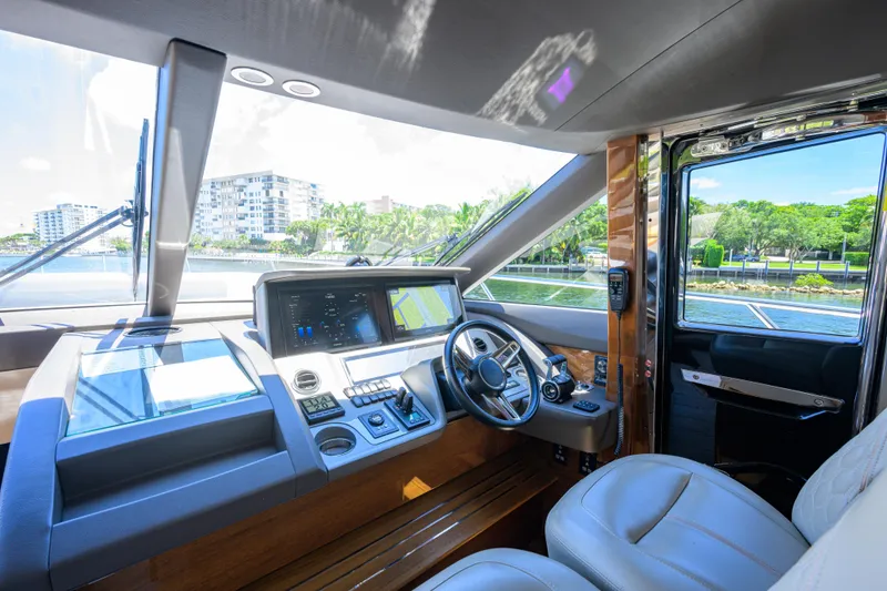 Slide: The Image of Luxurious 2020 Princess F70 yacht cockpit with modern navigation controls and waterfront view. - 25