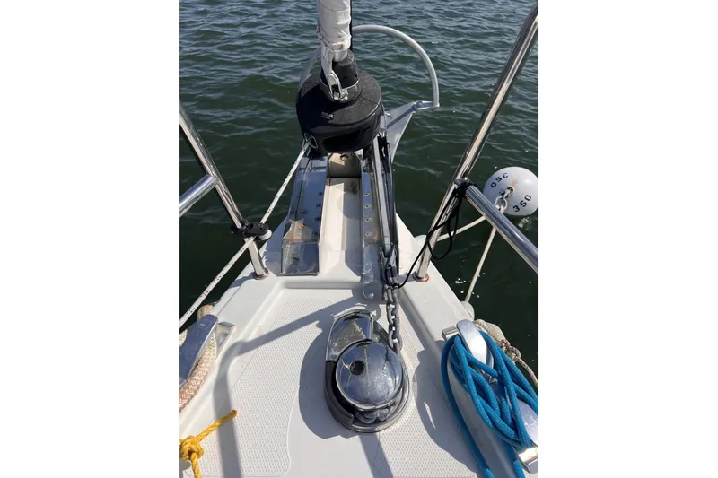 Slide: The Image of Bow of 2020 Hanse 458 sailboat with anchor and ropes on deck. - 10