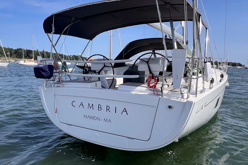 Slide: The Image of 2020 Hanse 458 sailboat named "Cambria" docked in Marion, MA, on a sunny day. - 8