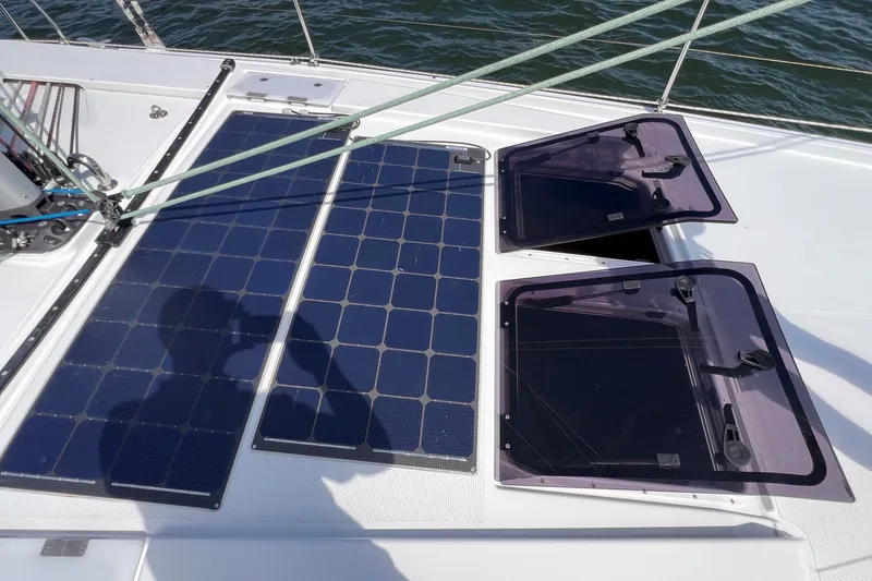 Slide: The Image of Solar panels on 2020 Hanse 458 yacht deck, with open hatches and rigging. - 12