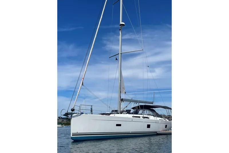Slide: The Image of Sailing yacht Hanse 458, 2020 model, anchored under a clear blue sky. - 5