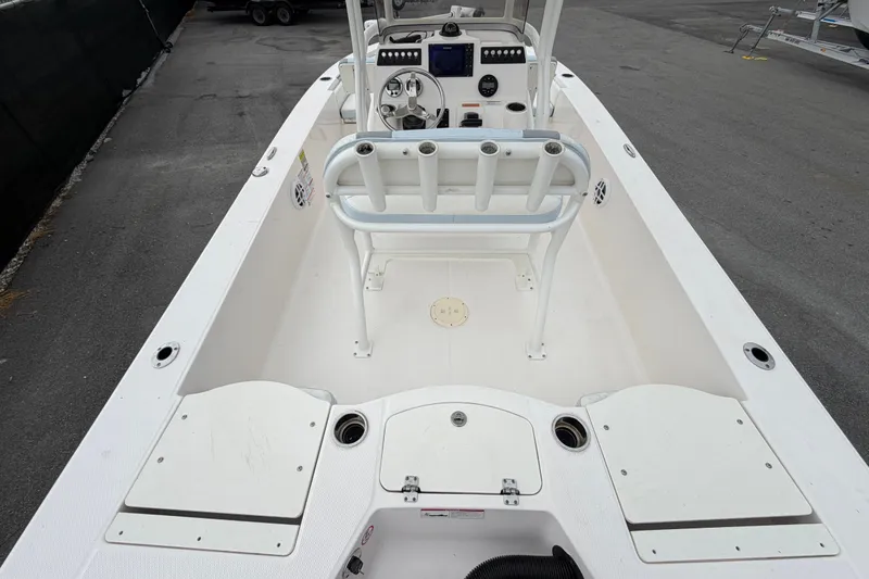 Slide: The Image of 2024 Robalo 206 Cayman boat interior with steering console and seating. - 12
