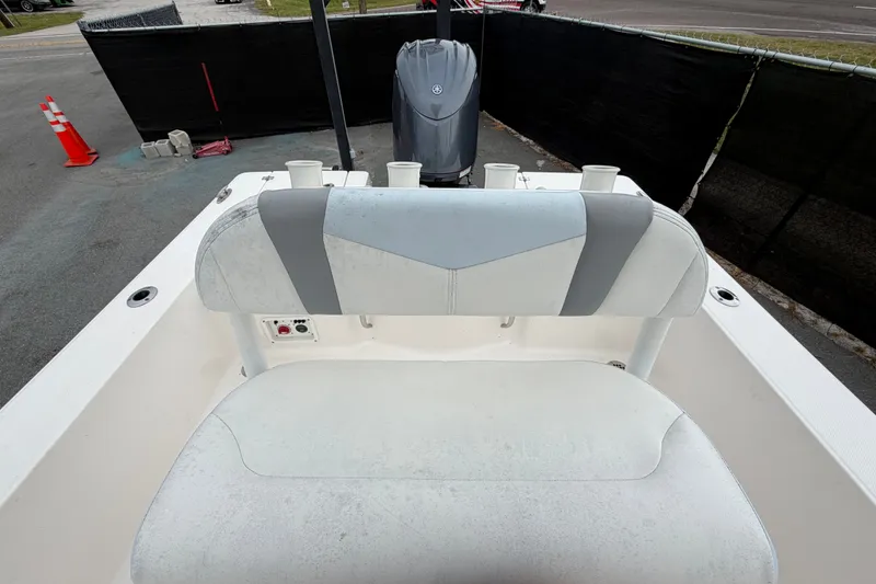 Slide: The Image of 2024 Robalo 206 Cayman boat interior with seating and motor view. - 45