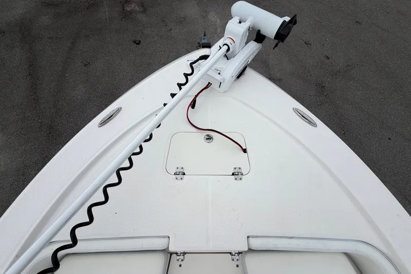 Slide: The Image of The image shows the bow of a Robalo 206 Cayman boat with a mounted trolling motor. - 32