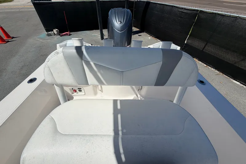 Slide: The Image of 2024 Robalo 206 Cayman boat interior with seating and motor view. - 30