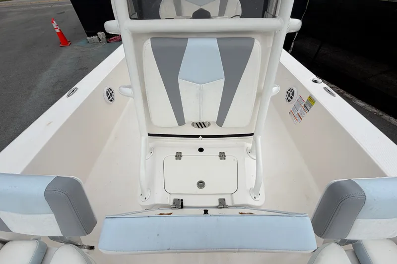 Slide: The Image of 2024 Robalo 206 Cayman boat interior with seating and storage compartments. - 41