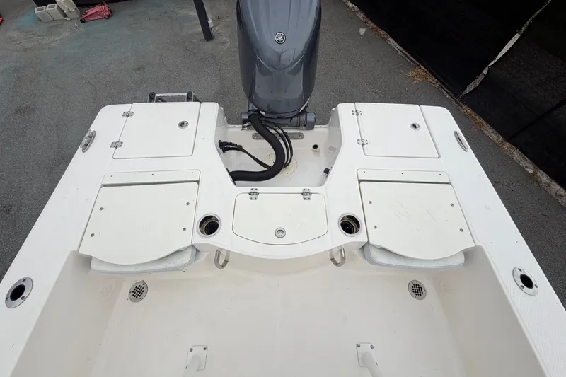 Slide: The Image of The image shows the stern of a 2024 Robalo 206 Cayman boat with an outboard motor. - 46