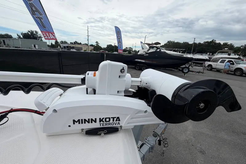 Slide: The Image of Minn Kota Terrova motor on 2024 Robalo 206 Cayman boat at dealership. - 36