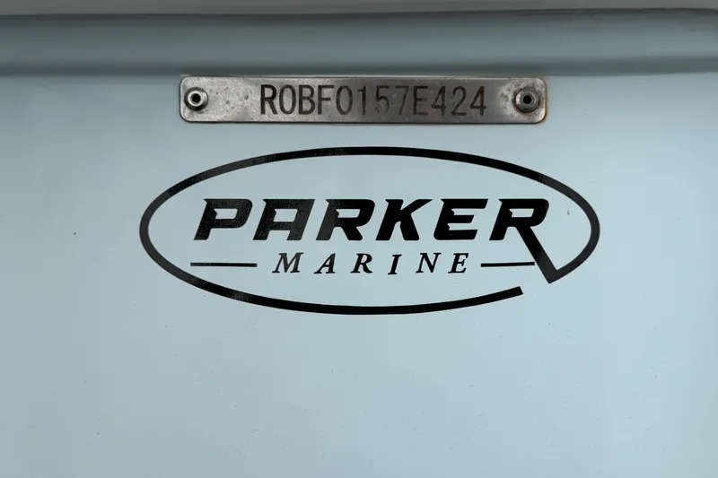 Slide: The Image of 2024 Robalo 206 Cayman boat with Parker Marine branding and serial number plate. - 64