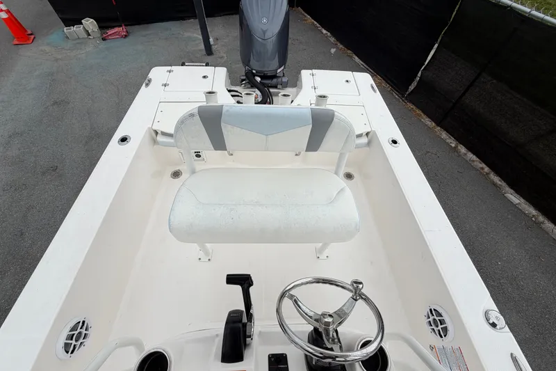 Slide: The Image of 2024 Robalo 206 Cayman boat interior with steering wheel and seating. - 44