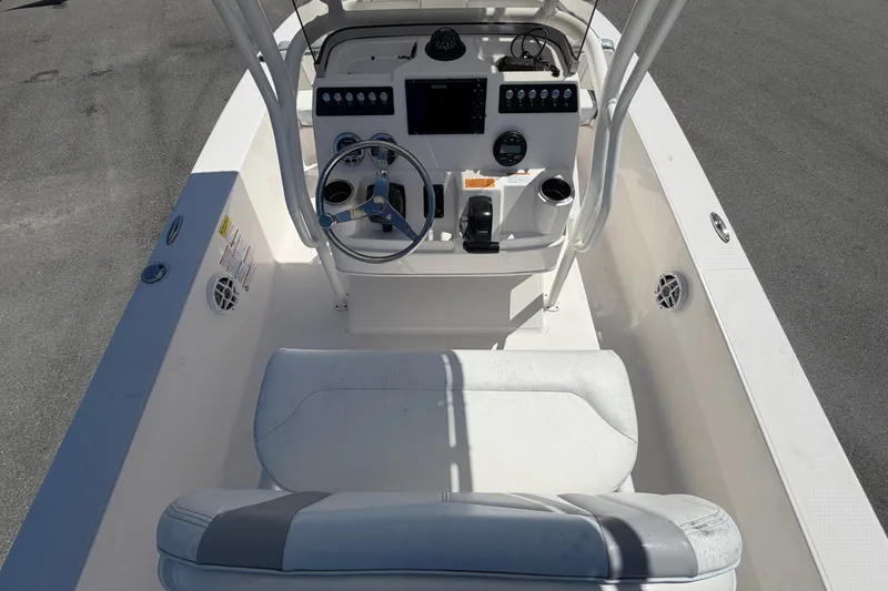 Slide: The Image of 2024 Robalo 206 Cayman boat cockpit with steering wheel and control panel. - 13