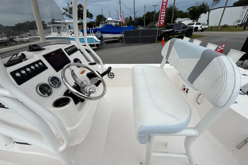 Slide: The Image of 2024 Robalo 206 Cayman boat interior with steering wheel and control panel. - 15