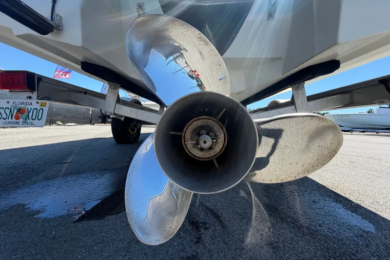 Slide: The Image of 2024 Robalo 206 Cayman boat propeller and trailer, Florida license plate visible. - 5