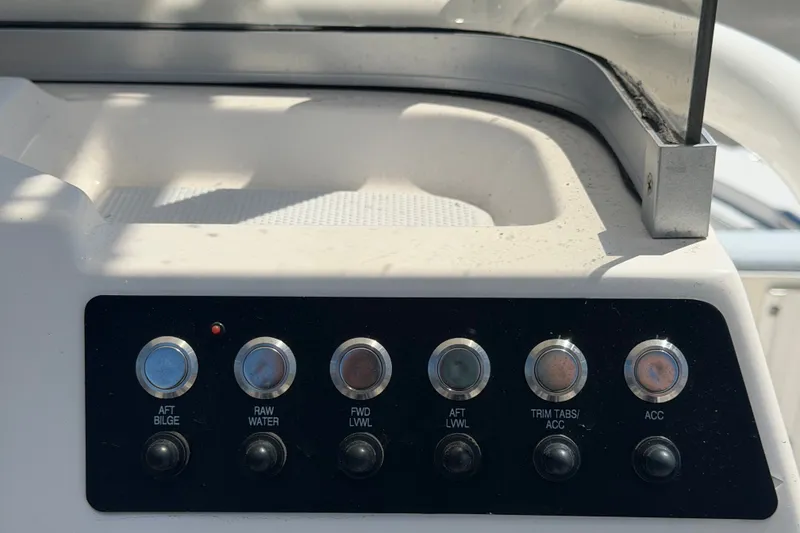 Slide: The Image of Control panel of 2024 Robalo 206 Cayman boat with labeled switches. - 17